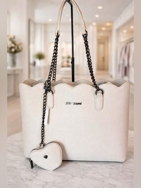 Betsey Johnson cream-colored tote bag black chain straps and heart-shaped charm